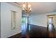 View of the open-concept living room featuring hardwood floors, a ceiling fan, and plenty of natural light at 1170 Pine Ridge W Cir # C2, Tarpon Springs, FL 34688