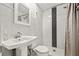 Clean bathroom featuring a shower with a black and white tiled accent stripe at 11811 Cypress Crest Cir, Tampa, FL 33626