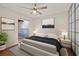Bedroom featuring a ceiling fan, neutral decor, and access to a private patio at 11811 Cypress Crest Cir, Tampa, FL 33626