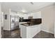 Bright kitchen featuring white cabinets, stainless steel appliances, and a functional layout at 11811 Cypress Crest Cir, Tampa, FL 33626