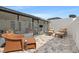 Private screened-in patio with neutral pavers, modern furniture, and a bright white fence for outdoor relaxation at 11811 Cypress Crest Cir, Tampa, FL 33626