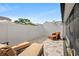 Private outdoor patio with neutral pavers, modern furniture, and serene white fence ensures secluded relaxation at 11811 Cypress Crest Cir, Tampa, FL 33626
