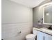 Updated half bathroom showcasing modern tilework, a white vanity, and a decorative hand towel at 14130 Rosemary Ln # 3215, Largo, FL 33774