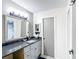 Bright bathroom featuring a modern vanity with great counter space, and updated fixtures at 14130 Rosemary Ln # 3215, Largo, FL 33774