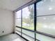 Bright sunroom with textured walls, large window view of fountain and landscaping at 14130 Rosemary Ln # 3215, Largo, FL 33774