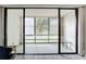 Spacious sunroom with large windows offering serene views of the well-maintained outdoor space at 14130 Rosemary Ln # 3215, Largo, FL 33774