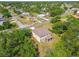 Spacious two-story home with a screened-in patio nestled among lush greenery in a quiet neighborhood at 14282 Coronado Dr, Spring Hill, FL 34609