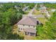Aerial view of home featuring lush greenery and neighborhood at 14282 Coronado Dr, Spring Hill, FL 34609