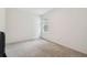 Bright, empty bedroom with a large window at 14282 Coronado Dr, Spring Hill, FL 34609