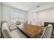 Bright dining room features a wooden table, padded chairs, and a window that provides natural lighting at 14282 Coronado Dr, Spring Hill, FL 34609