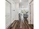 Hallway with hardwood floors leading to the living and dining areas, and the stairs at 14282 Coronado Dr, Spring Hill, FL 34609