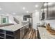 Kitchen with granite countertops, a stainless steel dishwasher, and dark wood cabinets at 14282 Coronado Dr, Spring Hill, FL 34609