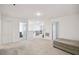 Open living space featuring carpet floors, nearby bedrooms and storage at 14282 Coronado Dr, Spring Hill, FL 34609