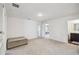 Large living area with carpet flooring, access to bedrooms and a bathroom at 14282 Coronado Dr, Spring Hill, FL 34609