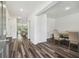 Open floor plan featuring dark hardwood floors, dining room, and living room with staircase at 14282 Coronado Dr, Spring Hill, FL 34609