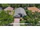 Attractive single-Gathering home surrounded by mature trees, a brick driveway, and lush landscaping at 16219 Nottingham Park Way, Tampa, FL 33647