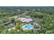 Aerial view featuring the community pool, playground, and clubhouse at 16219 Nottingham Park Way, Tampa, FL 33647