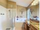 Bright bathroom features a walk-in shower, separate tub, double vanity, and stylish fixtures at 16219 Nottingham Park Way, Tampa, FL 33647