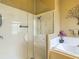 Bright bathroom features a walk-in shower, separate tub, double vanity, and stylish fixtures at 16219 Nottingham Park Way, Tampa, FL 33647
