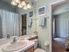 Charming bathroom with decorative accents, complemented by a view of the adjacent bedroom at 16219 Nottingham Park Way, Tampa, FL 33647