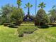Attractive 'Mayfair' community sign surrounded by lush landscaping and mature palm trees at 16219 Nottingham Park Way, Tampa, FL 33647