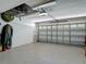 Spacious garage with clean epoxy floors, ample storage racks, and an automated door opener at 16219 Nottingham Park Way, Tampa, FL 33647