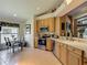 Well-lit kitchen with stainless steel appliances and eat in kitchen area at 16219 Nottingham Park Way, Tampa, FL 33647