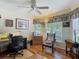 Bright office space with wood floors, desk, comfortable seating, and plenty of natural light at 16219 Nottingham Park Way, Tampa, FL 33647
