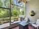Enjoy this screened patio with its outside grill, table, and landscaping view for relaxing evenings at 16219 Nottingham Park Way, Tampa, FL 33647