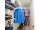 Organized walk-in closet with shelves, hanging rods, and ample storage space at 16219 Nottingham Park Way, Tampa, FL 33647