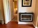 Stylish modern wall decor and electric fireplace feature add character and warmth to this home at 16219 Nottingham Park Way, Tampa, FL 33647