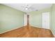Bedroom featuring hardwood floors, a ceiling fan, and a closet at 1908 Canterbury Ln # 28, Sun City Center, FL 33573