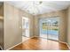 Dining room with a modern chandelier and sliding glass doors to the lanai at 1908 Canterbury Ln # 28, Sun City Center, FL 33573