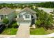 Beautiful two-story home with a brick paver driveway and well-maintained landscaping at 19200 Roseate Dr, Lutz, FL 33558