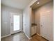 Inviting foyer featuring tile flooring, a storage closet, and a convenient drop zone at 19200 Roseate Dr, Lutz, FL 33558