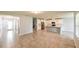 Open-concept living room flowing into a modern kitchen with stainless steel appliances at 19200 Roseate Dr, Lutz, FL 33558