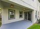 Covered patio with sliding glass door and two windows at 19200 Roseate Dr, Lutz, FL 33558
