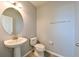 Cozy powder room with pedestal sink, tile flooring, and neutral wall color at 19200 Roseate Dr, Lutz, FL 33558