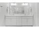 Bathroom vanity features double sinks, bright lighting and a spacious mirror at 202 S Tampania Ave # 3, Tampa, FL 33609