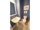 Stylish half bathroom with unique tile flooring, modern fixtures, and fresh paint at 202 S Tampania Ave # 3, Tampa, FL 33609