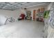 Spacious garage with epoxy floors, storage, and bike rack at 202 S Tampania Ave # 3, Tampa, FL 33609