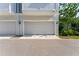Attached two-car garage offering secure parking and convenient access to the home at 202 S Tampania Ave # 3, Tampa, FL 33609