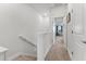 Upstairs hallway with carpet and an open doorway leading to a living space at 202 S Tampania Ave # 3, Tampa, FL 33609