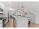 Spacious kitchen with island, stainless steel appliances, and view of the living and dining areas at 202 S Tampania Ave # 3, Tampa, FL 33609