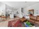 Open living area showcasing a kitchen, staircase, and laminate flooring at 202 S Tampania Ave # 3, Tampa, FL 33609