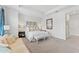 A stylish main bedroom features neutral walls, carpet, and contemporary furnishings and decor at 202 S Tampania Ave # 3, Tampa, FL 33609