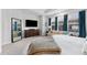 Comfortable bedroom with a large bed, dresser, sitting area, and natural light at 202 S Tampania Ave # 3, Tampa, FL 33609
