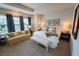 Serene bedroom featuring a king-size bed, sitting area, and lots of natural light at 202 S Tampania Ave # 3, Tampa, FL 33609