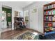 A functional home office featuring wood floors, natural light, and a built-in bookcase at 202 S Tampania Ave # 3, Tampa, FL 33609