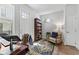 Bright home office with a large window, wood floors, an area rug, and a comfortable chair at 202 S Tampania Ave # 3, Tampa, FL 33609